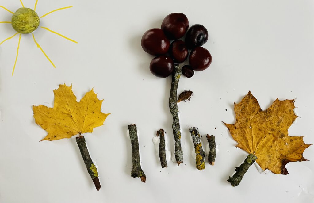 Gebasteltes Herbst-Bild aus Kastanien und Blättern